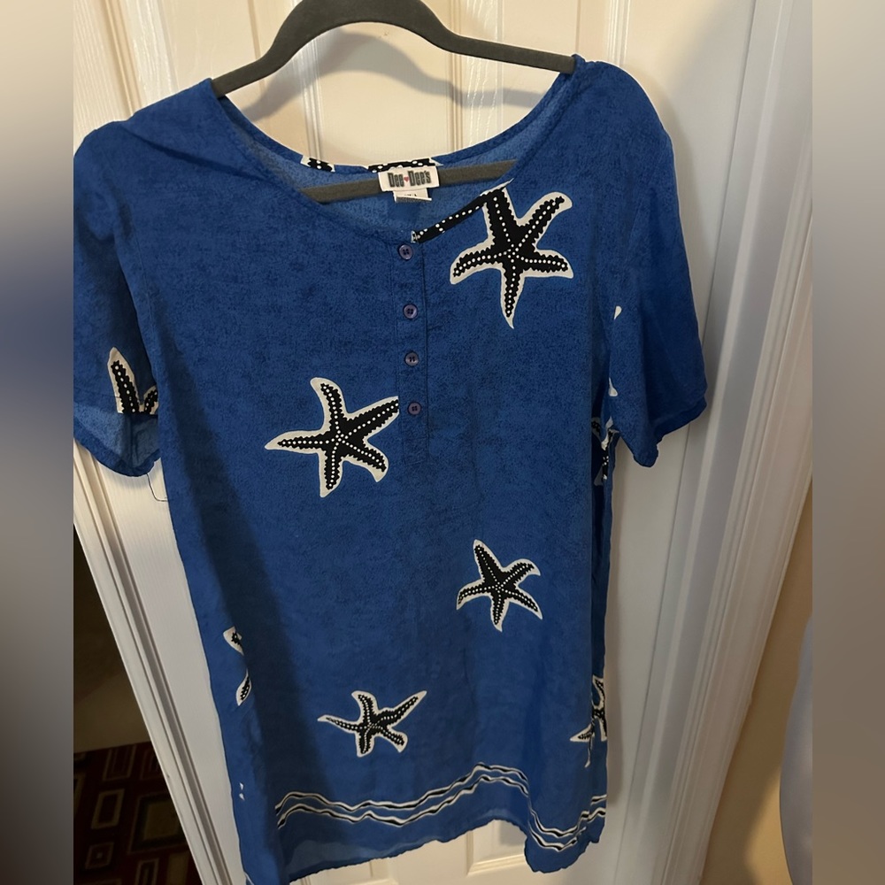 This Dee Dee’s size L ocean blue starfish pattern dress above the knee length.